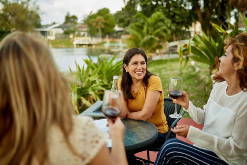 Women enjoy a glass of wine on vacation in Sanibel Island