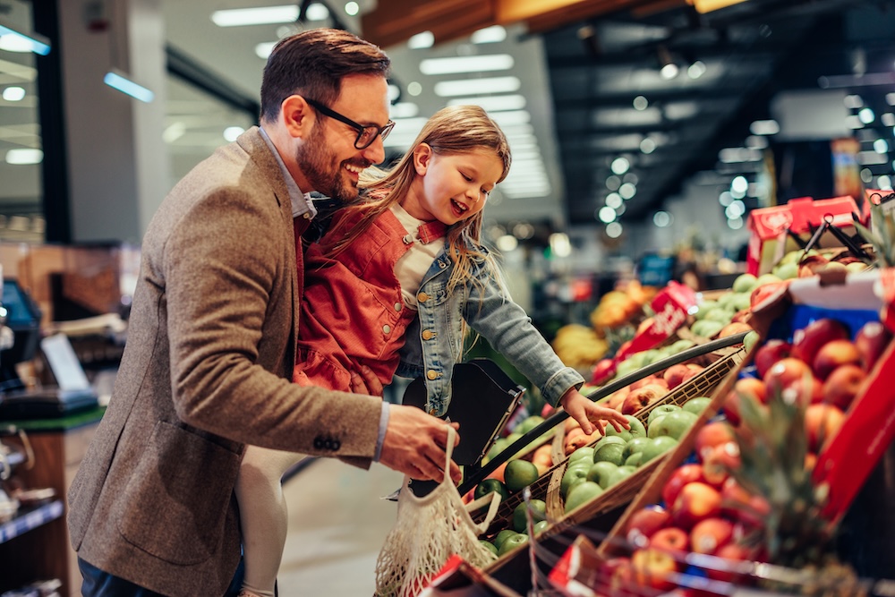 Father and daughter shopping in a grocery store