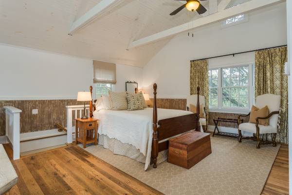 large loft bedroom with classic decor