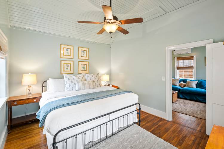 Pictured: king bedroom looking into the living area at Cornwall Cottage