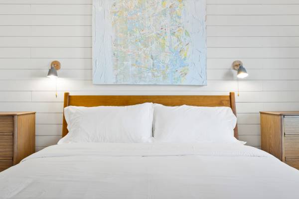 bed with mountain reading lamps