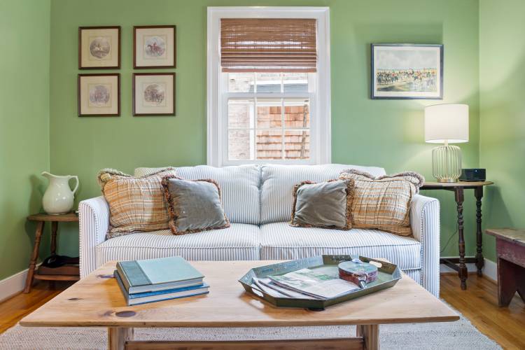 Pictured: Living Room with couch and coffee table at Devon Cottage