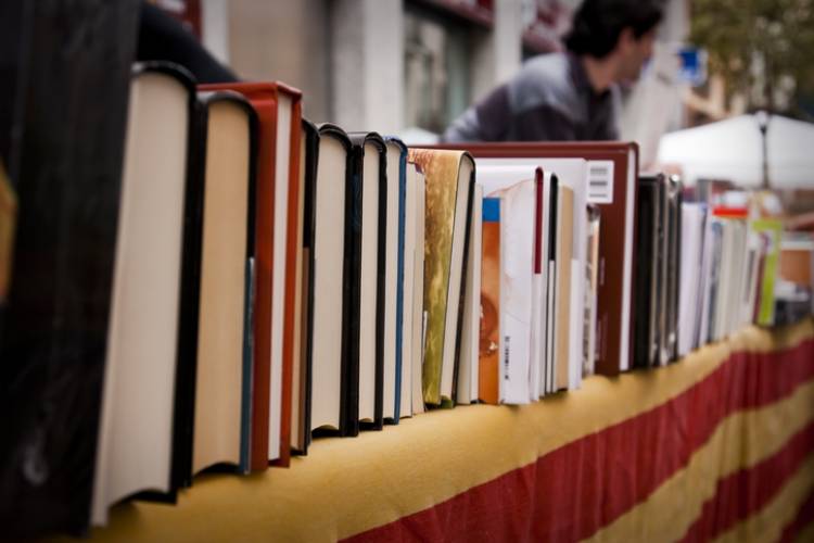 Books stacked at a festival in Charlottesville