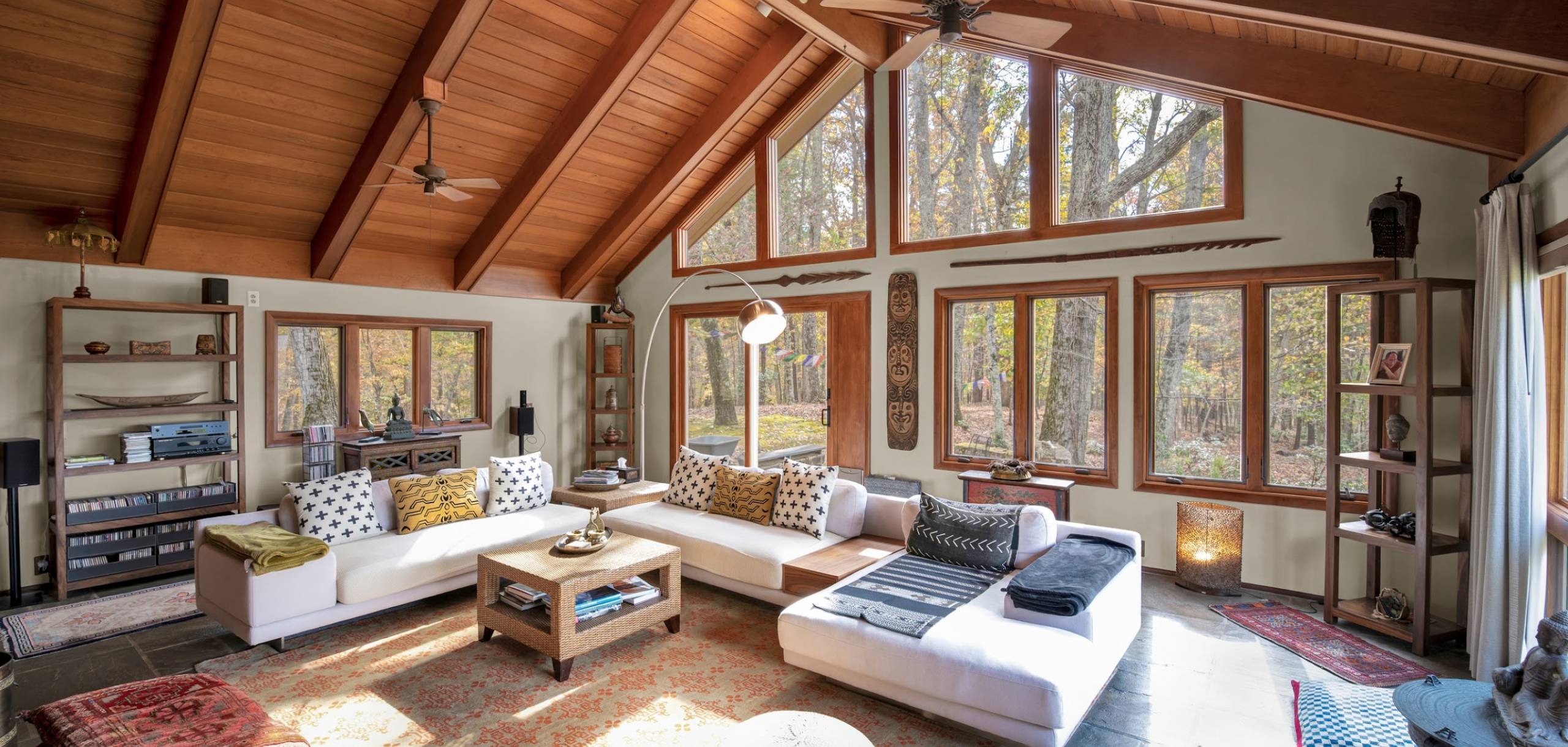 living room with high ceiling and large windows