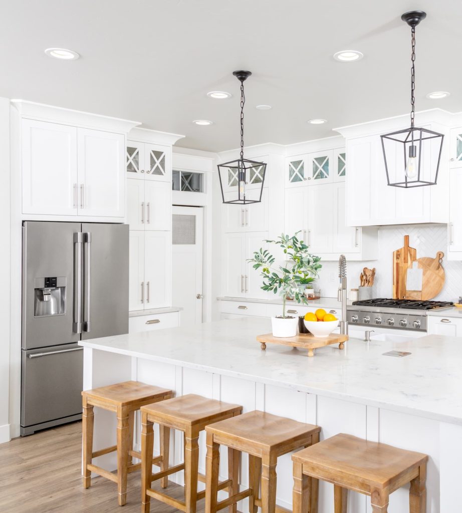 Luxury kitchen, bright and airy white with stainless steel appliances 