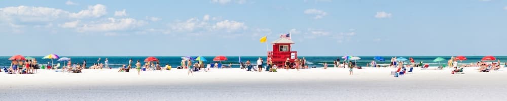 people on Crescent Beach in FL