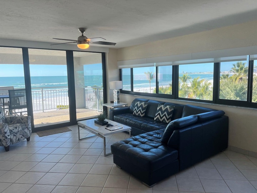 view of beach through windows in a waterfront condo at siesta sands in florida