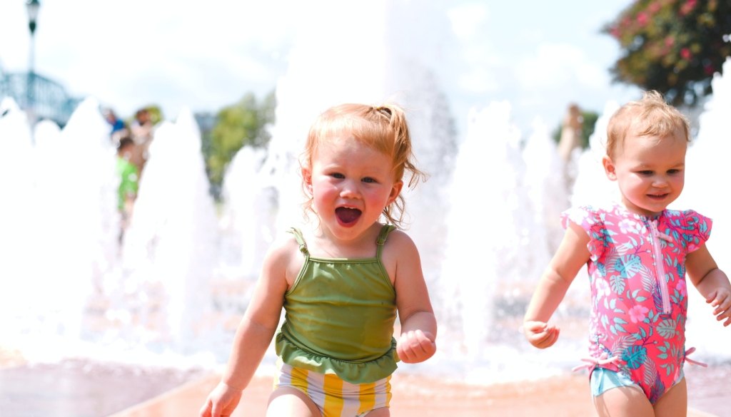toddlers running in splash pad at OWA
