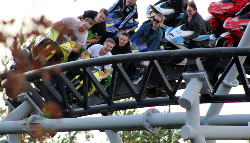 group of adults on roller coaster