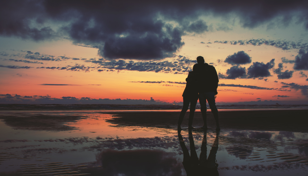 couple on beach at sunset