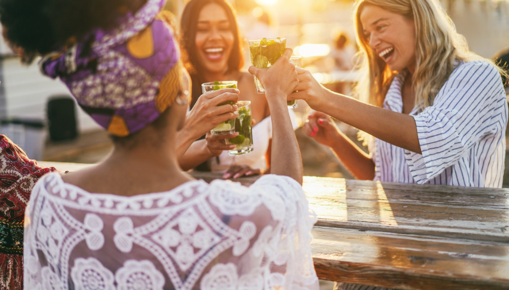 girls having a drink at a beach bar in gulf shores, alabama