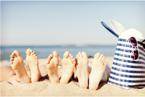 kids feet on the beach