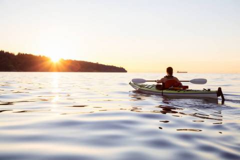A person kayaking, one of the best Port Aransas Activities to do on a solo vacation.