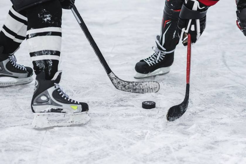 playing hockey close up on puck and skates