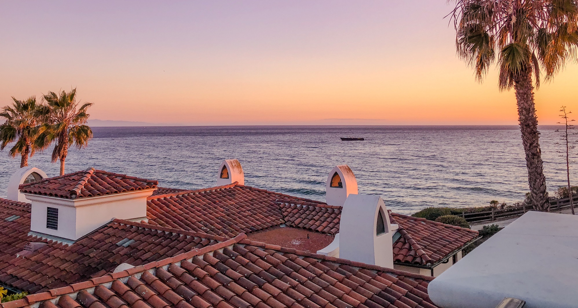 Sunset sky over Pacific ocean, view from a top floor
